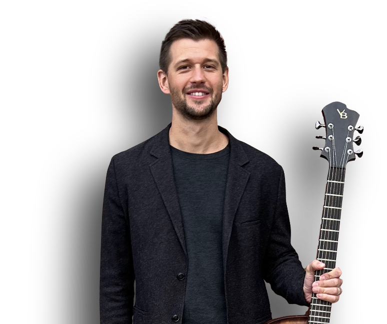 Brent holding guitar